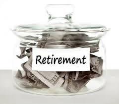 Clear glass retirement savings jar filled with U.S. dollar bills