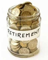 Glass retirement savings jar filled with coins